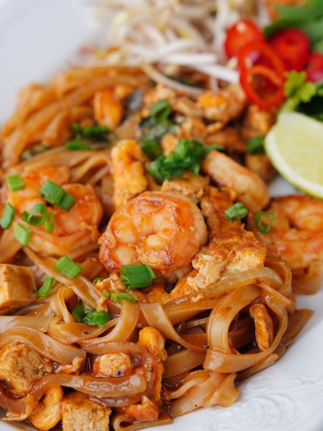 A close-up look on a plate of mouth-watering garlic butter shrimp pasta